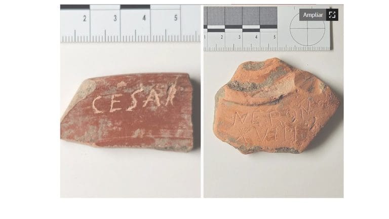 Fragmentos de cerámica con inscripciones “CÉSAR” y “NERON XVIIII”, hallados en el yacimiento arqueológico de Iruña-Veleia, con escalas métricas visibles.